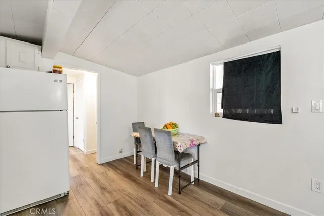 a kitchen with a sink stove and white cabinets