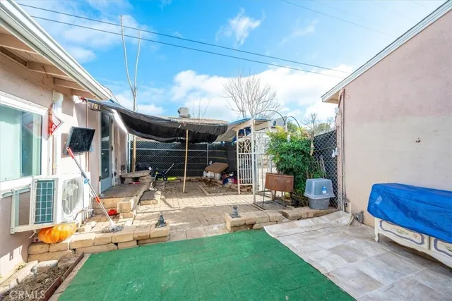 a room with a wooden floor and furniture