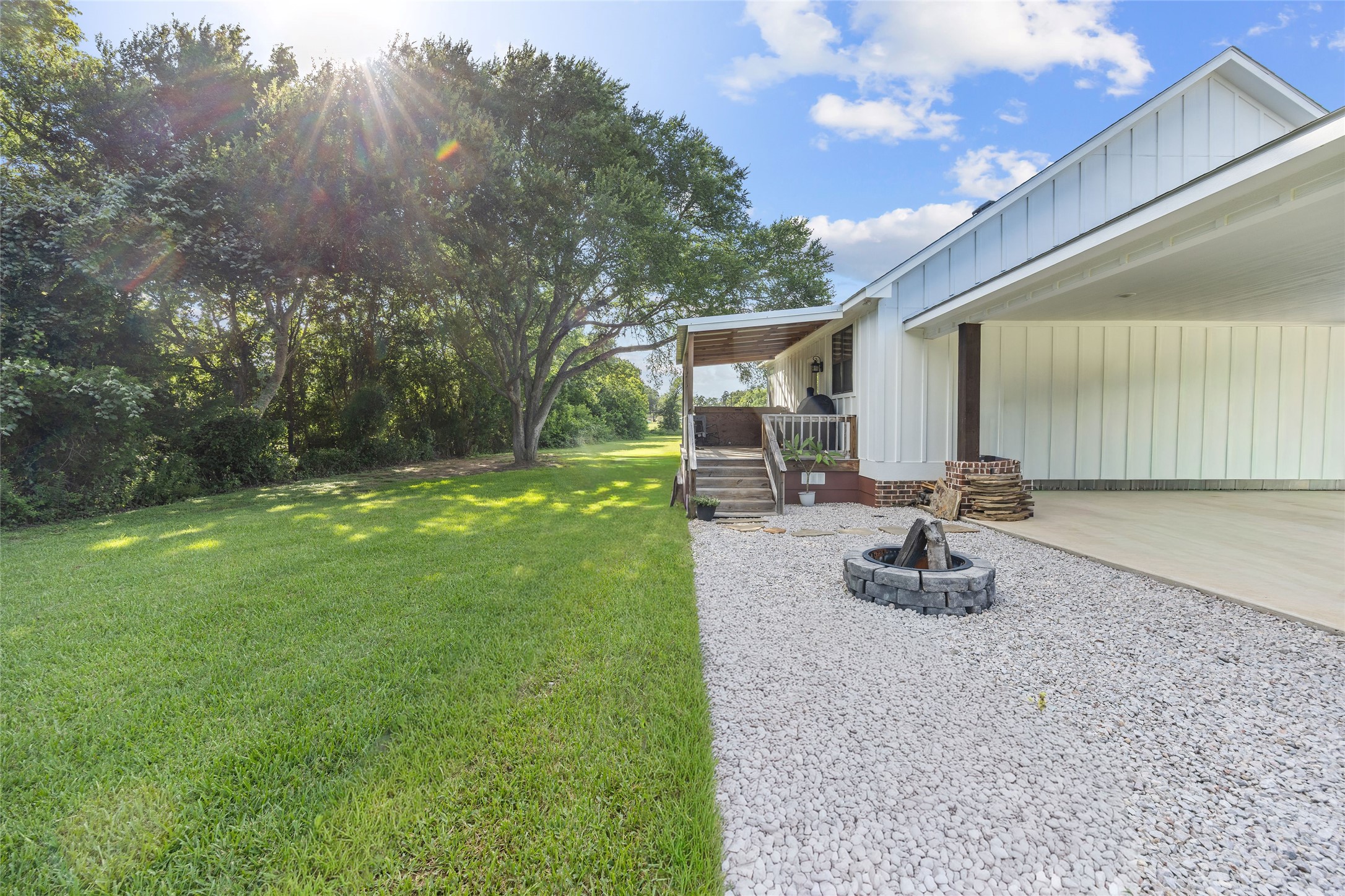 2021 Strangmeier Road Brenham, TX 77833 - Photo 4 of 16 Low-maintenance landscaping along with a well maintained lawn add gorgeous curb appeal.
