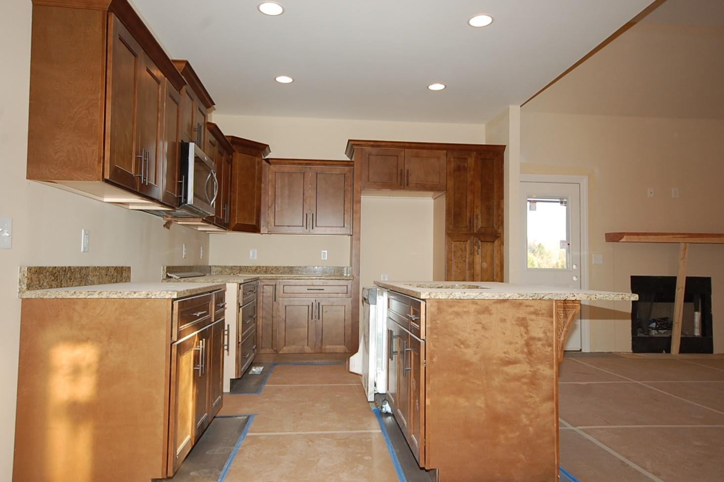 45 Hamilton Chambers Road Lebanon, TN 37087 - Photo 4 of 6 a kitchen with stainless steel appliances granite countertop a refrigerator a stove and a sink with cabinets