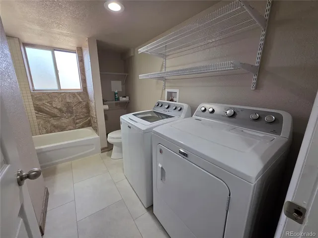 a bathroom with a sink mirror toilet and bathtub