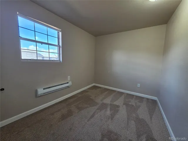 an empty room with closet area