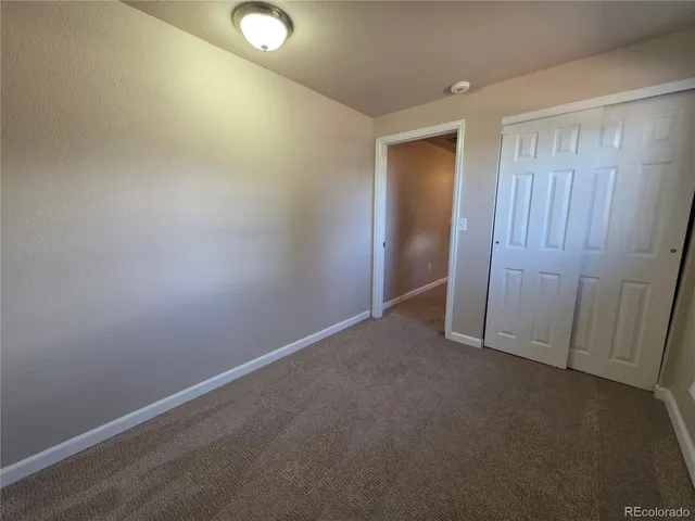 a building outdoor space with wooden floor and windows