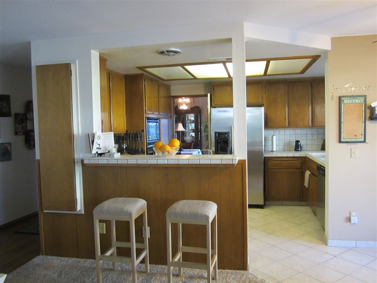 1622 Hackamore Road Oceanside, CA 92057 - Photo 12 of 25 Breakfast bar from family room. Built in ironing board on wall to the left.