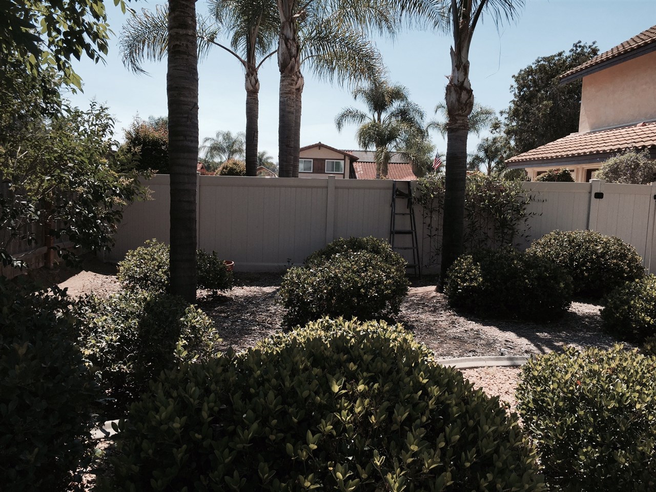 1622 Hackamore Road Oceanside, CA 92057 - Photo 21 of 25 spacious side yard looking toward driveway & garage.