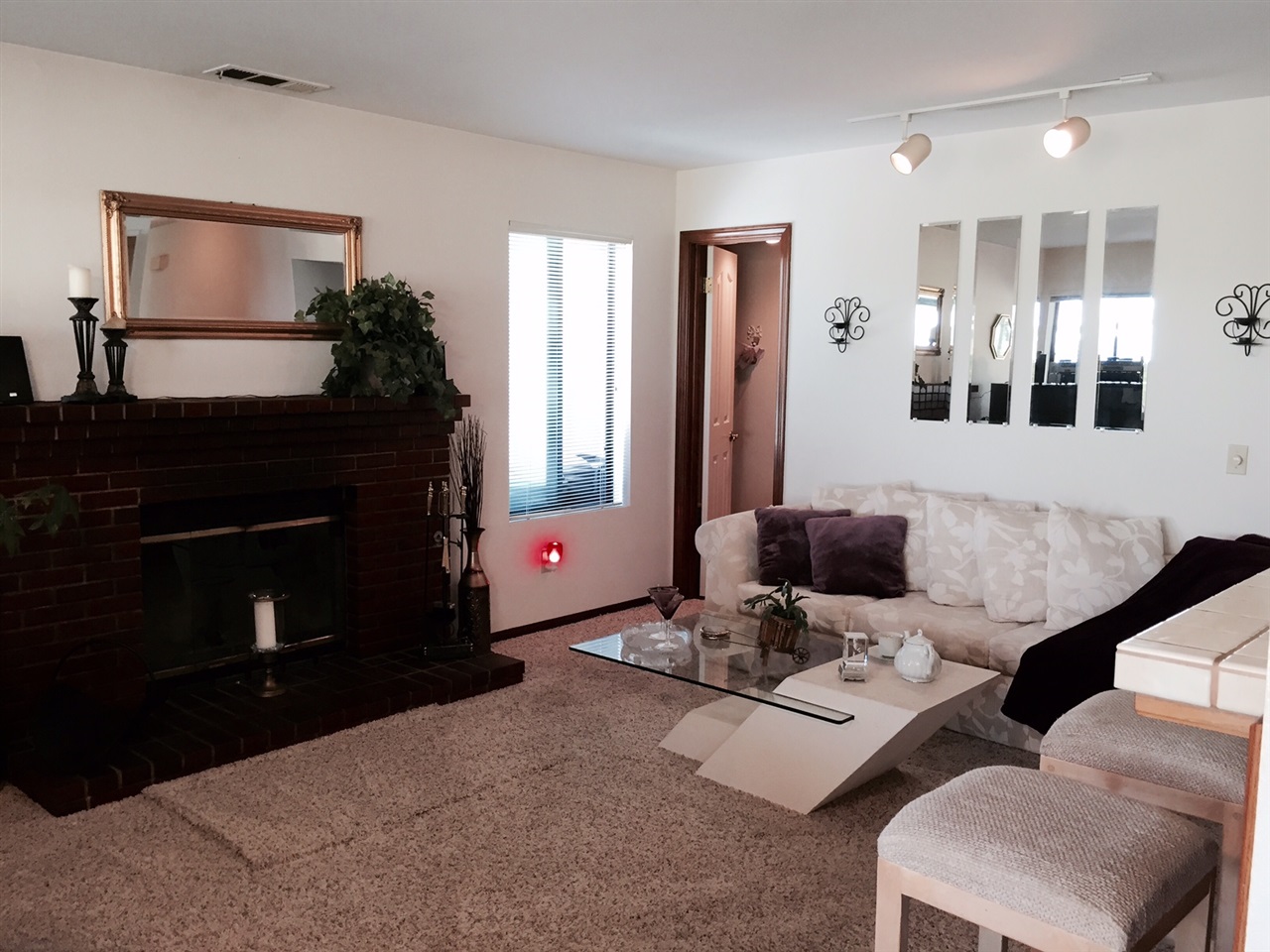 1622 Hackamore Road Oceanside, CA 92057 - Photo 7 of 25 Fireplace with gas starter, breakfast bar. Powder bath.