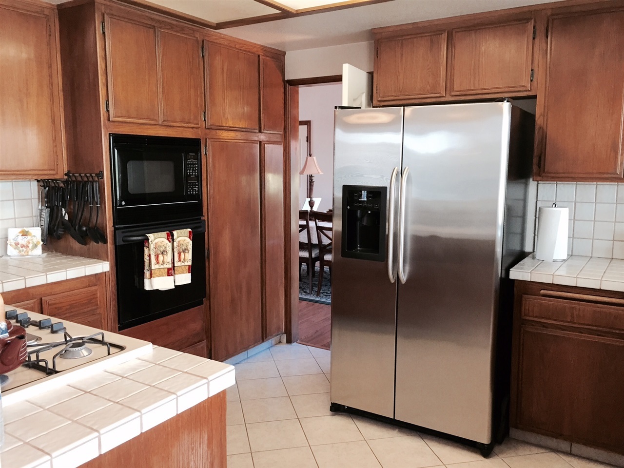 1622 Hackamore Road Oceanside, CA 92057 - Photo 9 of 25 Gas stove, oven & microwave, large stainless frig.