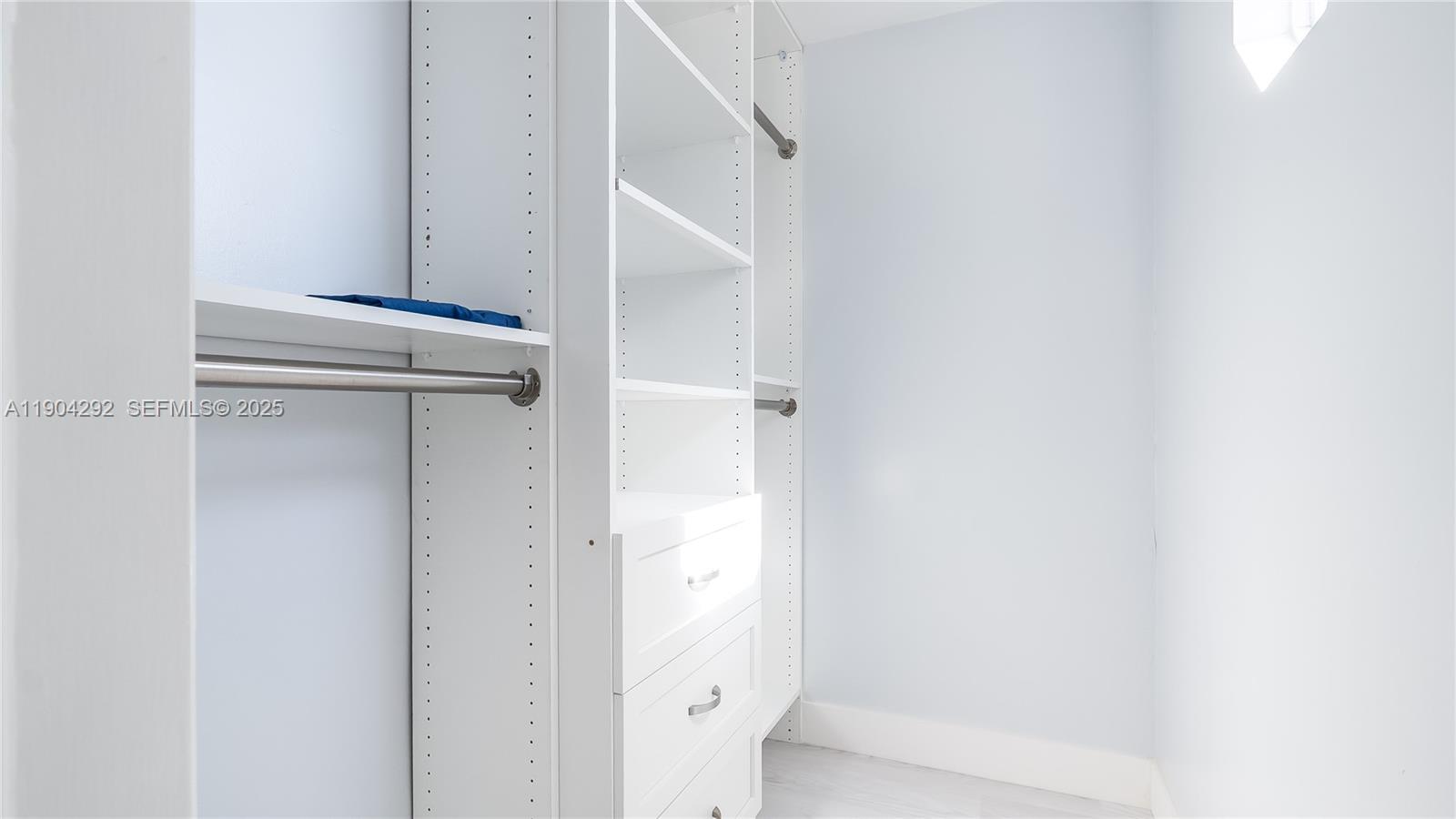 2445 Southeast 8th Street Pompano Beach, FL 33062 - Photo 30 of 42 a view of walk in closet with empty racks