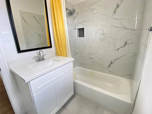 a bathroom with a sink and a bathtub