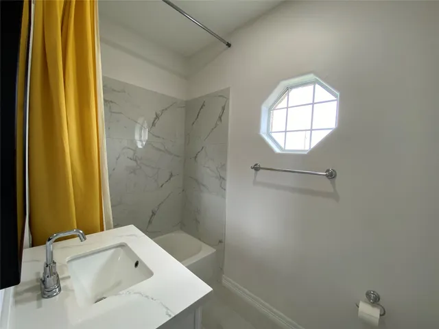 a bathroom with a sink and a tub
