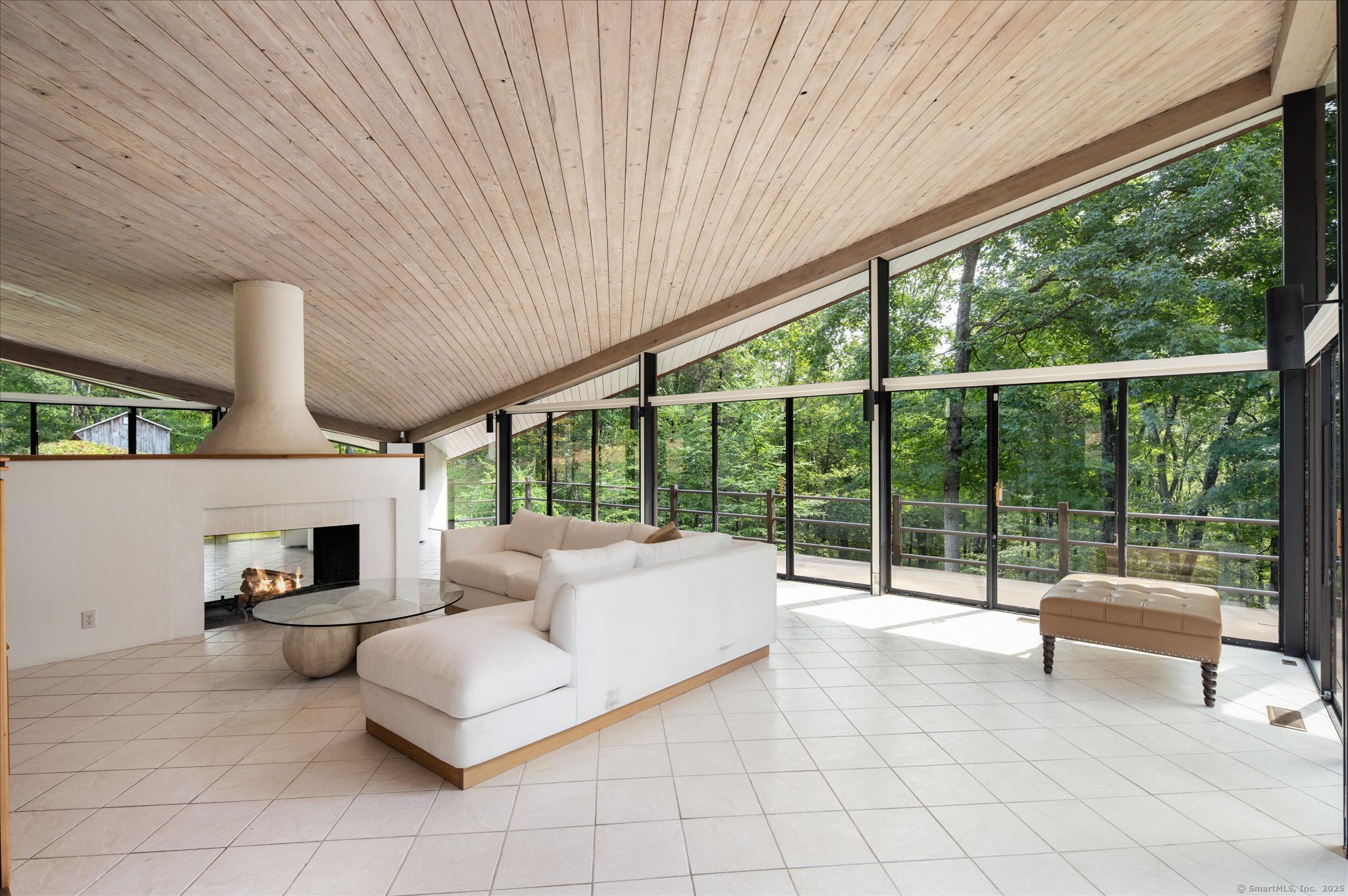 44 Benedict Hill Road New Canaan, CT 06840 - Photo 11 of 27 a living room with furniture and a large window