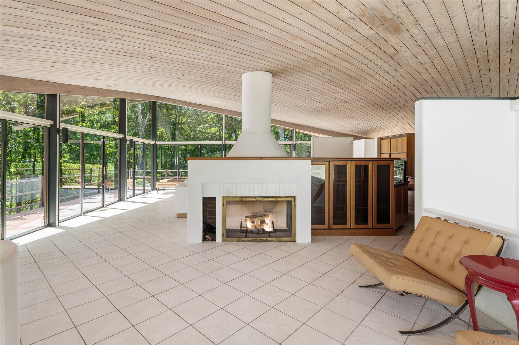 44 Benedict Hill Road New Canaan, CT 06840 - Photo 14 of 27 a living room with furniture and a fireplace