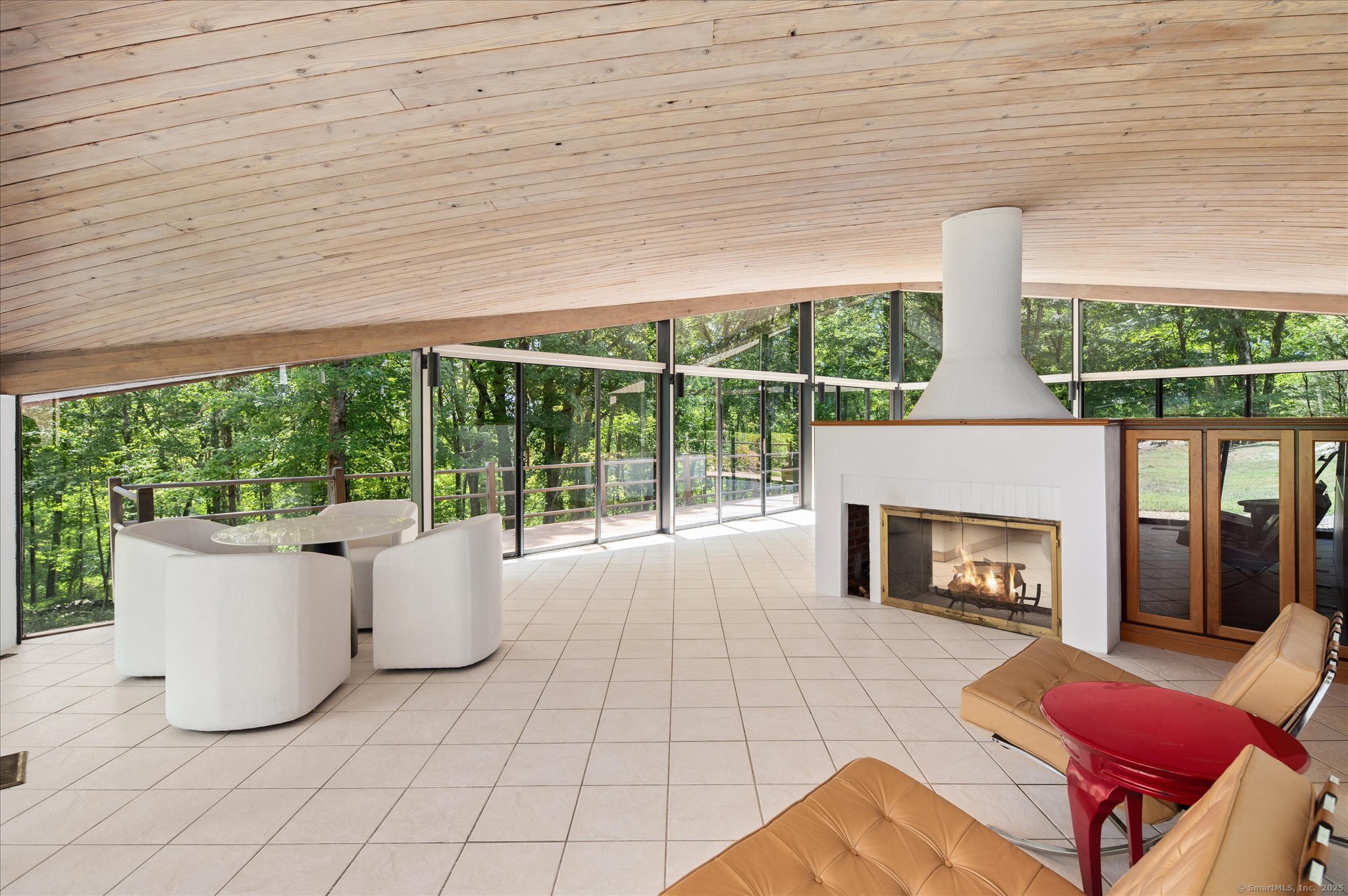 44 Benedict Hill Road New Canaan, CT 06840 - Photo 15 of 27 a living room with furniture and a fireplace