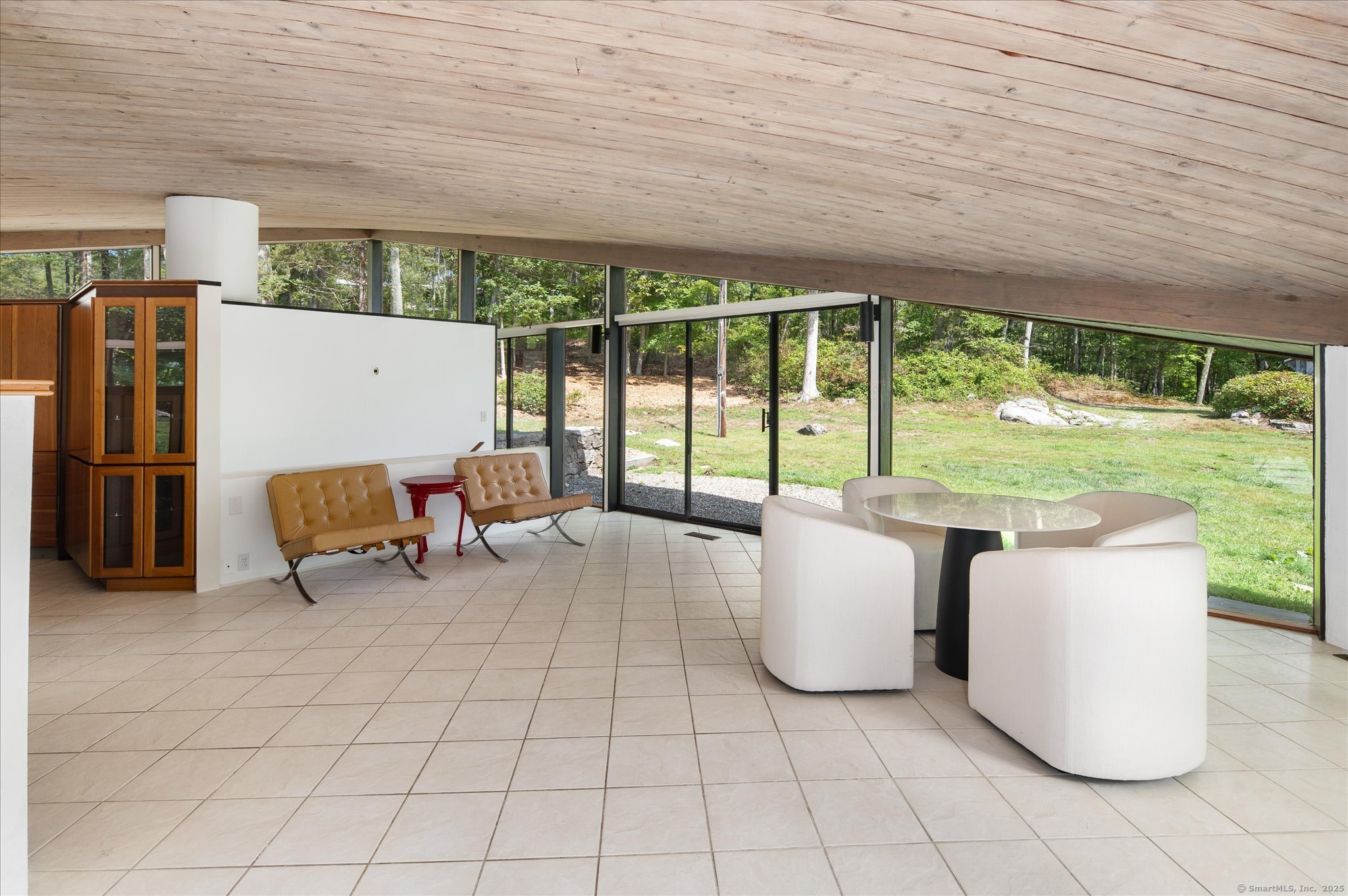 44 Benedict Hill Road New Canaan, CT 06840 - Photo 16 of 27 a living room with furniture and large windows