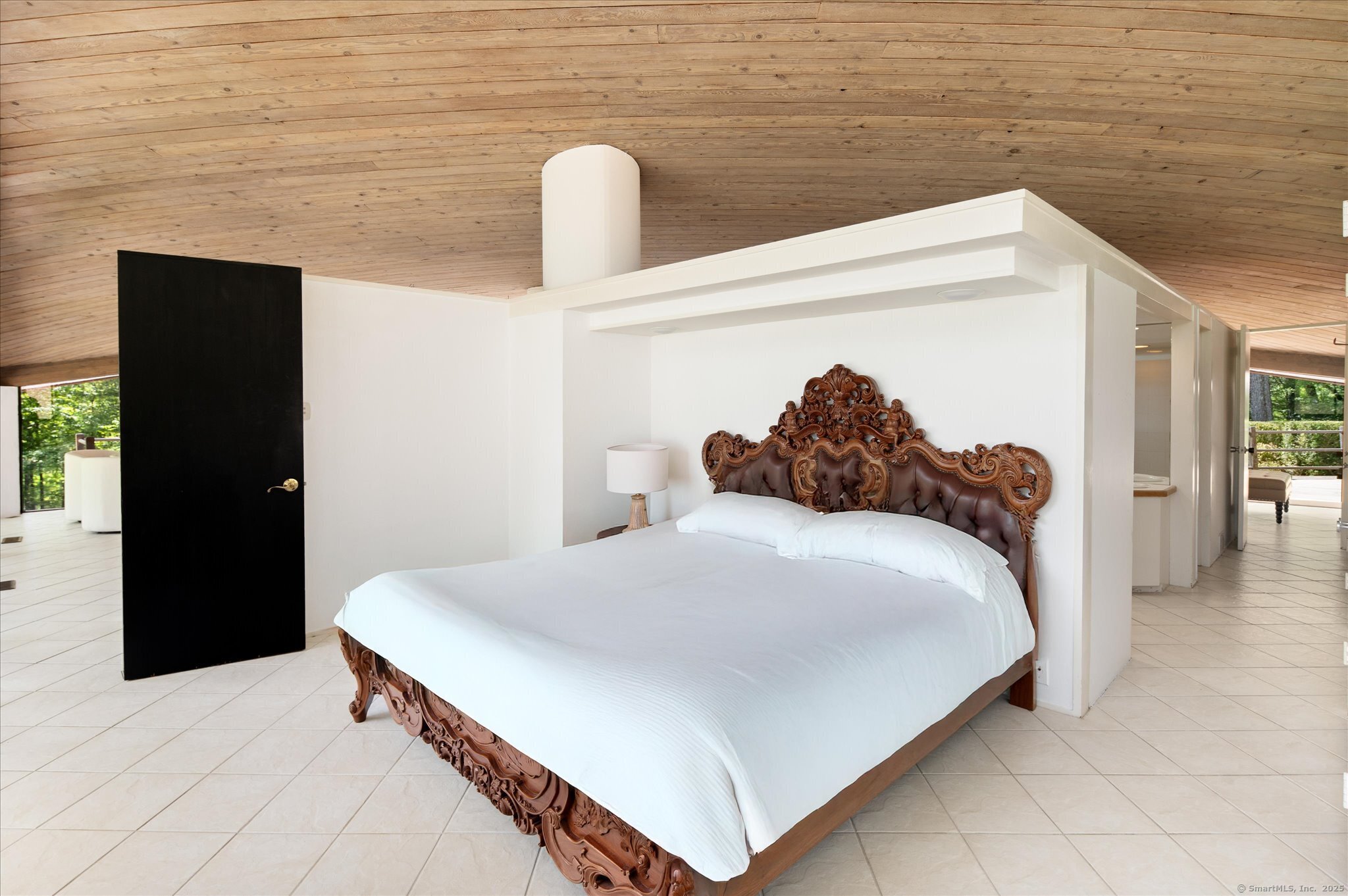 44 Benedict Hill Road New Canaan, CT 06840 - Photo 17 of 27 a bedroom with a bed and a chandelier