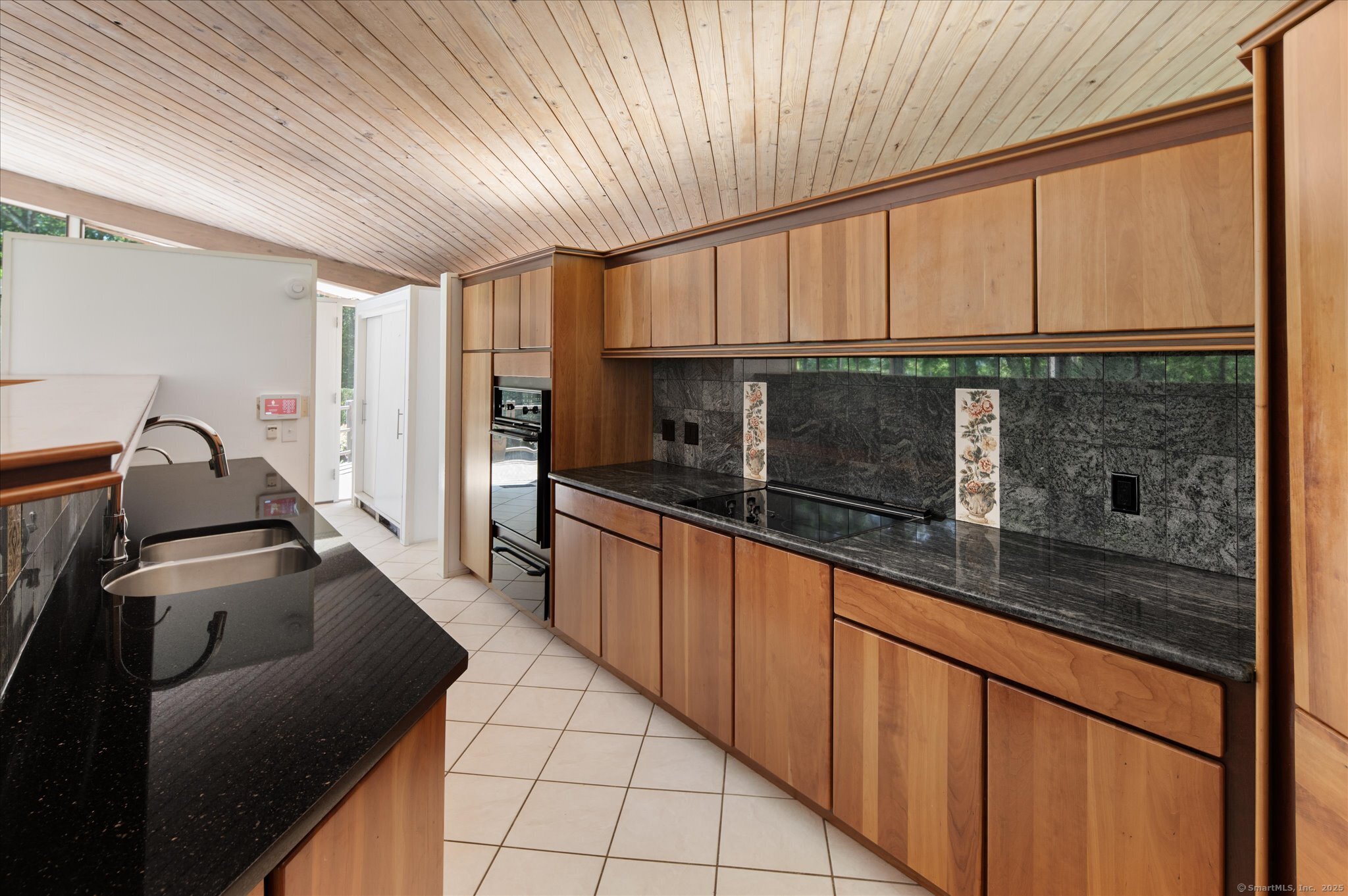 44 Benedict Hill Road New Canaan, CT 06840 - Photo 20 of 27 a kitchen with stainless steel appliances granite countertop a sink and a counter space
