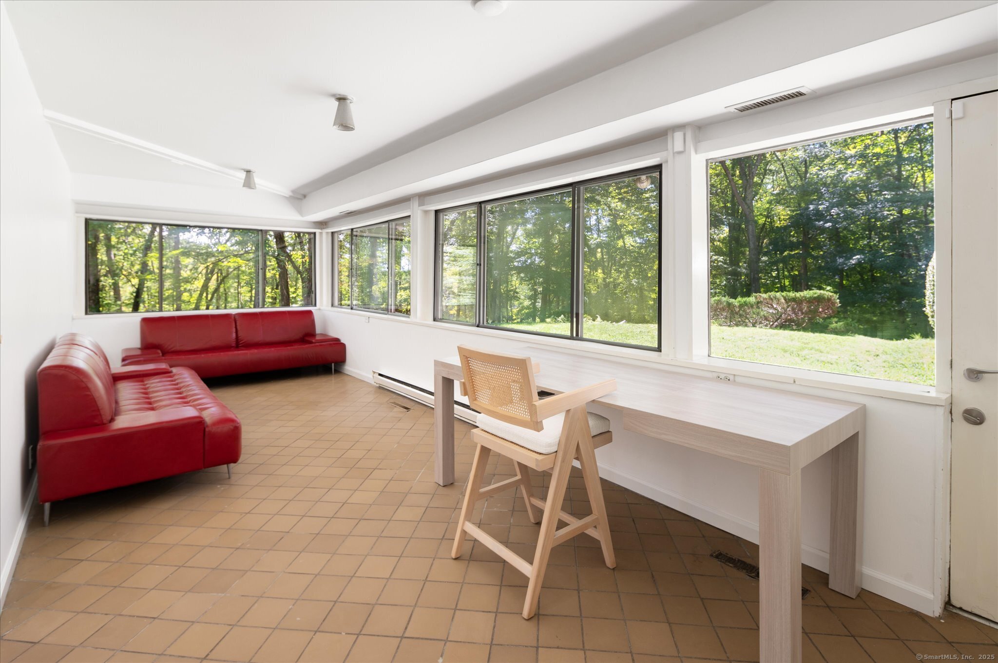 44 Benedict Hill Road New Canaan, CT 06840 - Photo 21 of 27 a living room with furniture and a large window