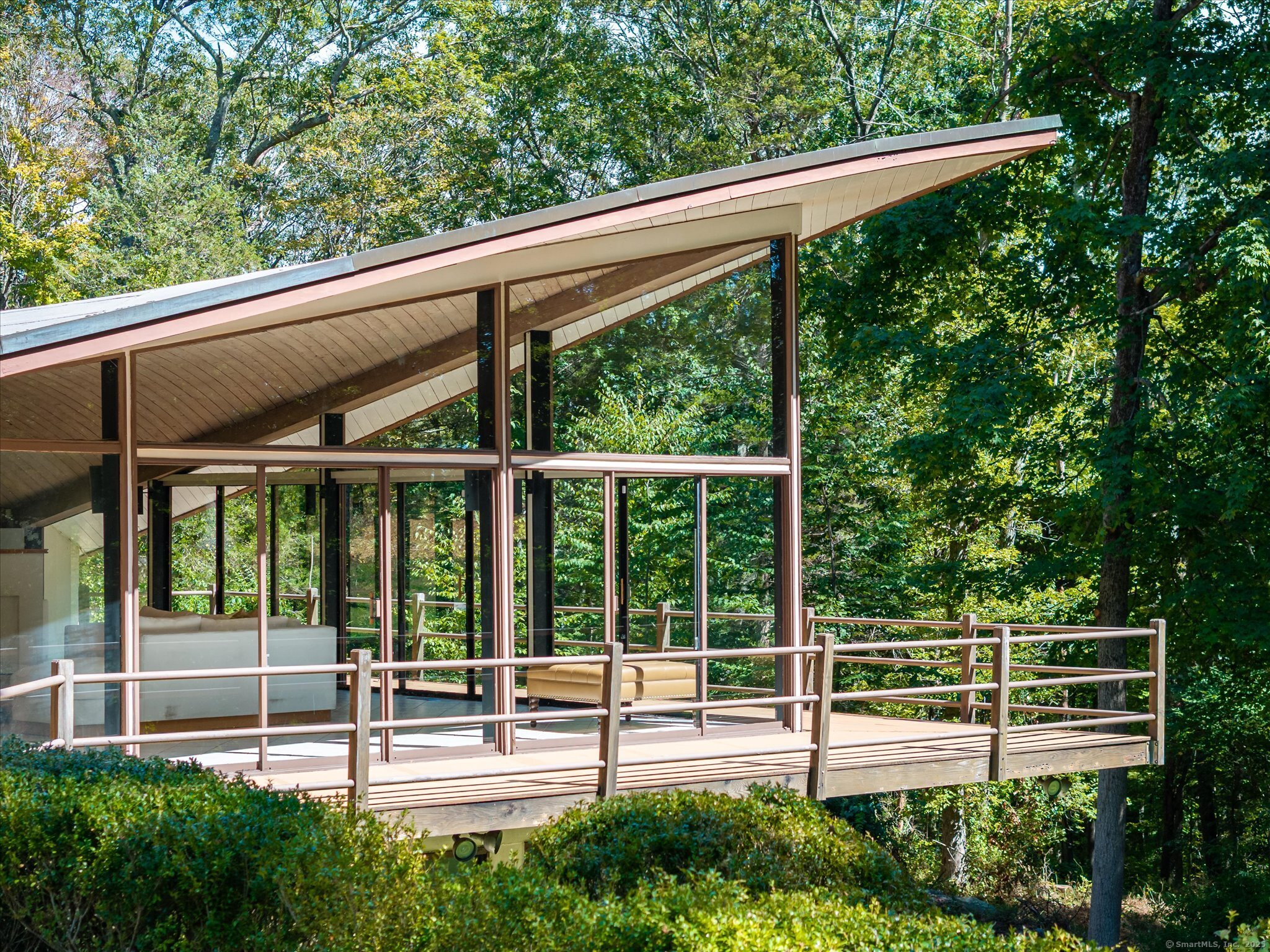 44 Benedict Hill Road New Canaan, CT 06840 - Photo 26 of 27 a view of a patio with table and chairs with wooden floor and fence