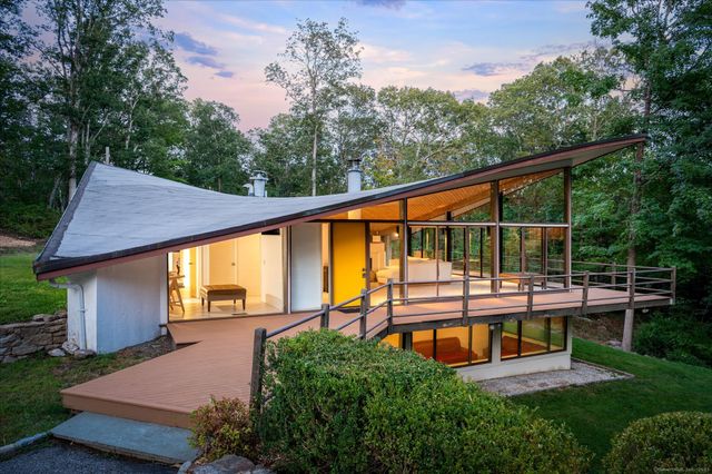 a view of a backyard with sitting area