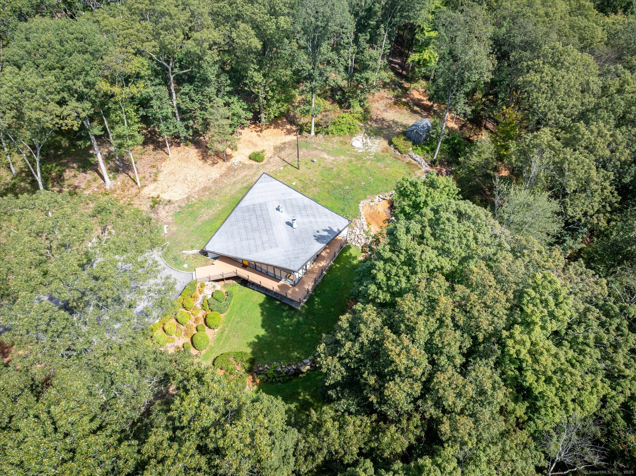 44 Benedict Hill Road New Canaan, CT 06840 - Photo 10 of 27 an aerial view of a house with a yard swimming pool and lake view