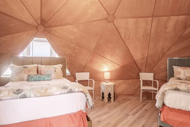 a bedroom with a bed and a night stand