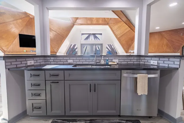 a living room with fireplace furniture and a wooden floor