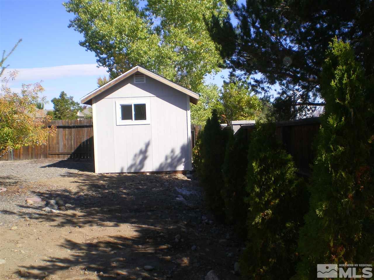 370 Flanders Road Reno, NV 89511 - Photo 12 of 25 a view of a house with a tree in the background