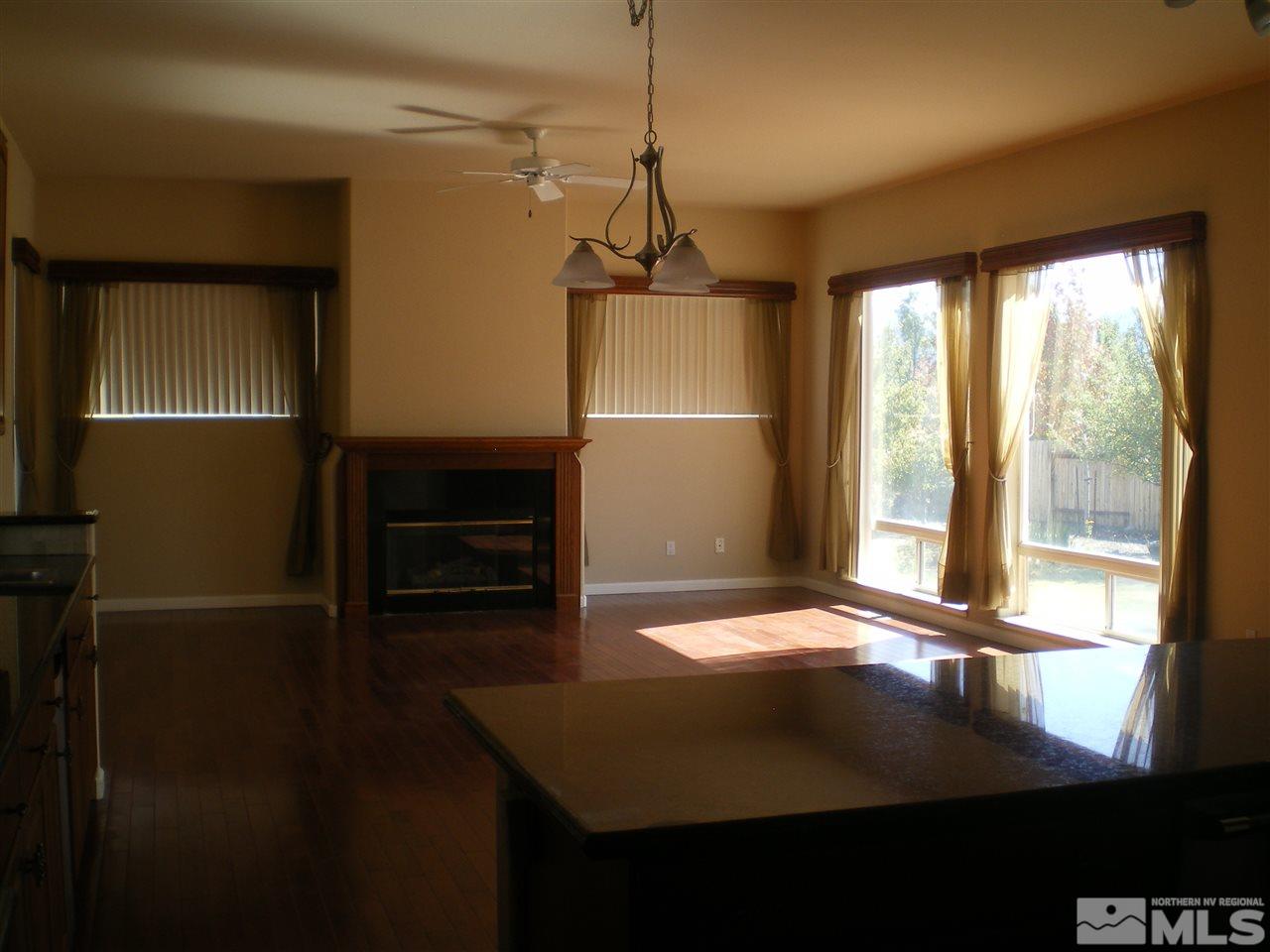 370 Flanders Road Reno, NV 89511 - Photo 16 of 25 a view of a room with a ceiling fan and window