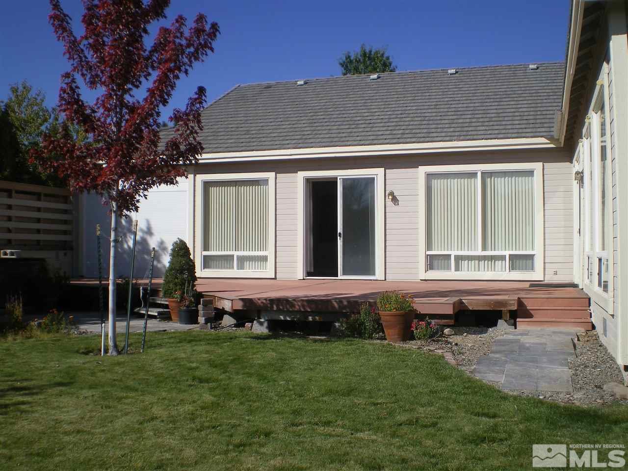 370 Flanders Road Reno, NV 89511 - Photo 9 of 25 a view of house with backyard outdoor seating and hardwood