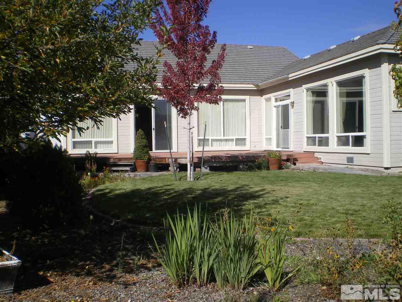 370 Flanders Road Reno, NV 89511 - Photo 10 of 25 a front view of house with yard and green space