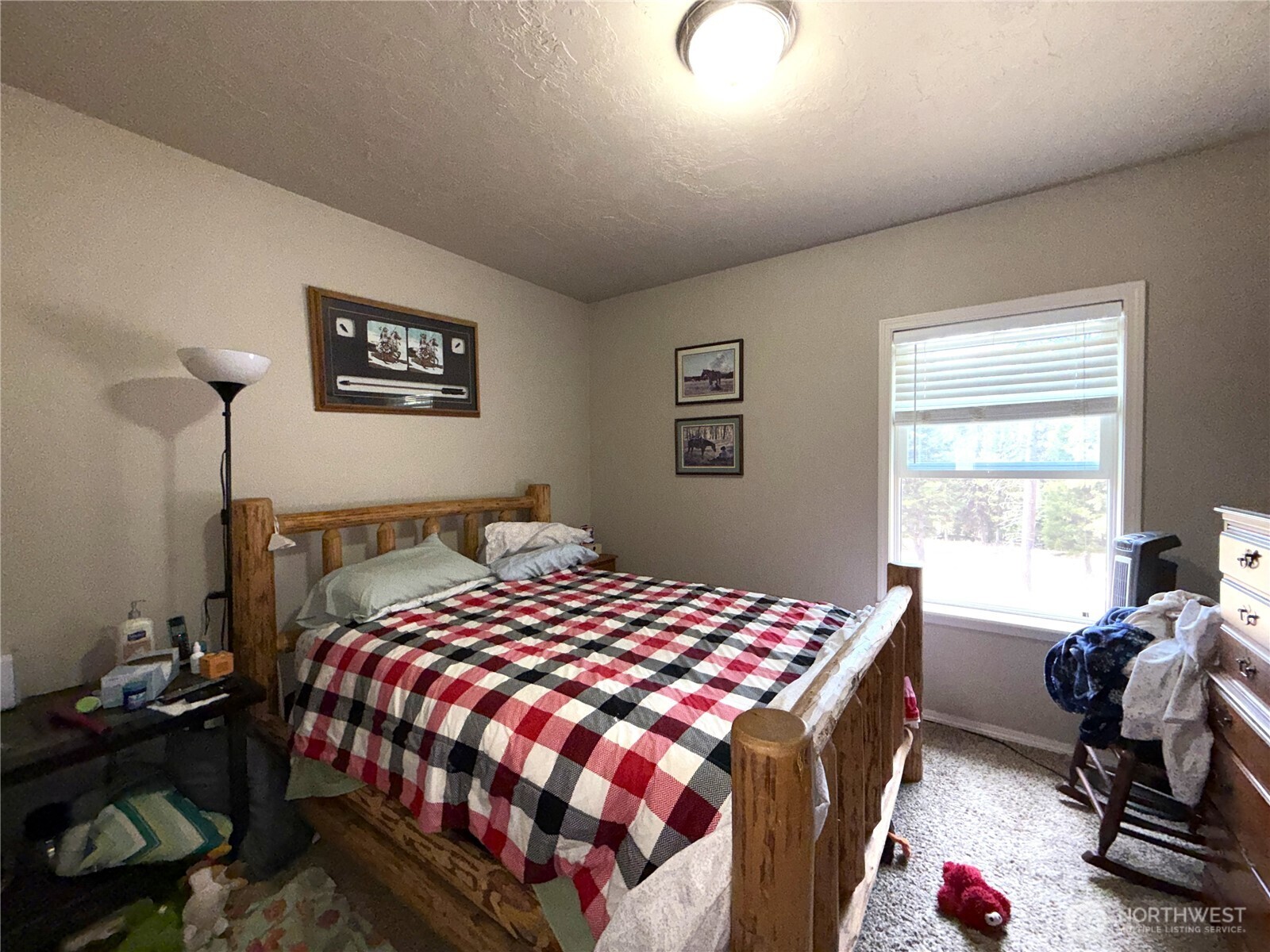 116 Cape Labelle Road Wauconda, WA 98859 - Photo 8 of 35 a bedroom with a bed and a window
