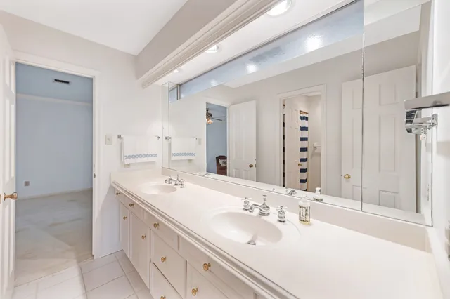 a bathroom with a sink double vanity and a mirror