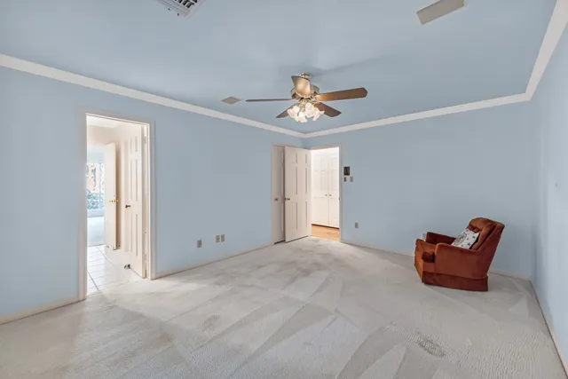 a view of a livingroom with a piano and wooden floor