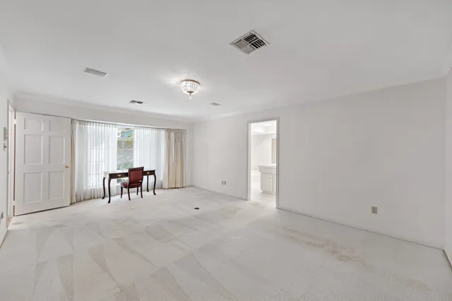 a view of dining room with furniture and window