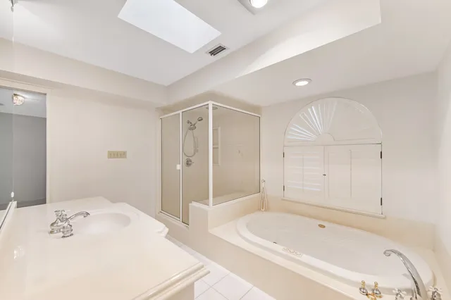 a bathroom with a bathtub and a sink