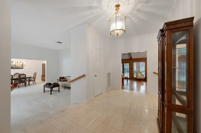 a view of a livingroom kitchen and dinning room with wooden floor