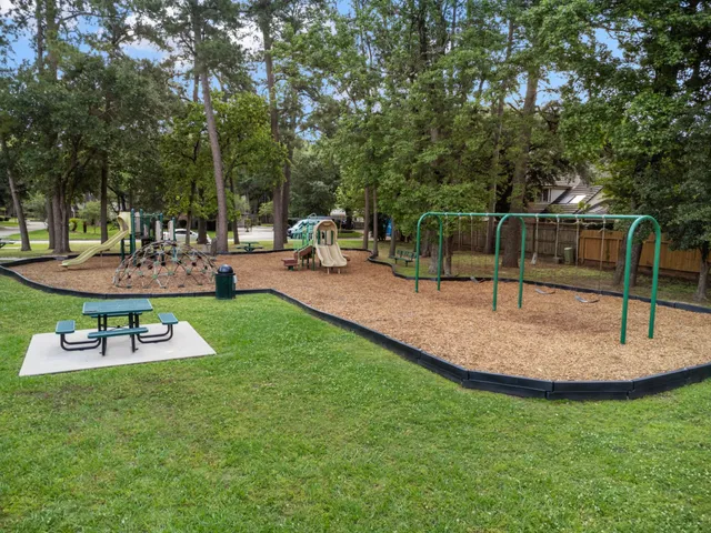a view of a backyard with sitting area