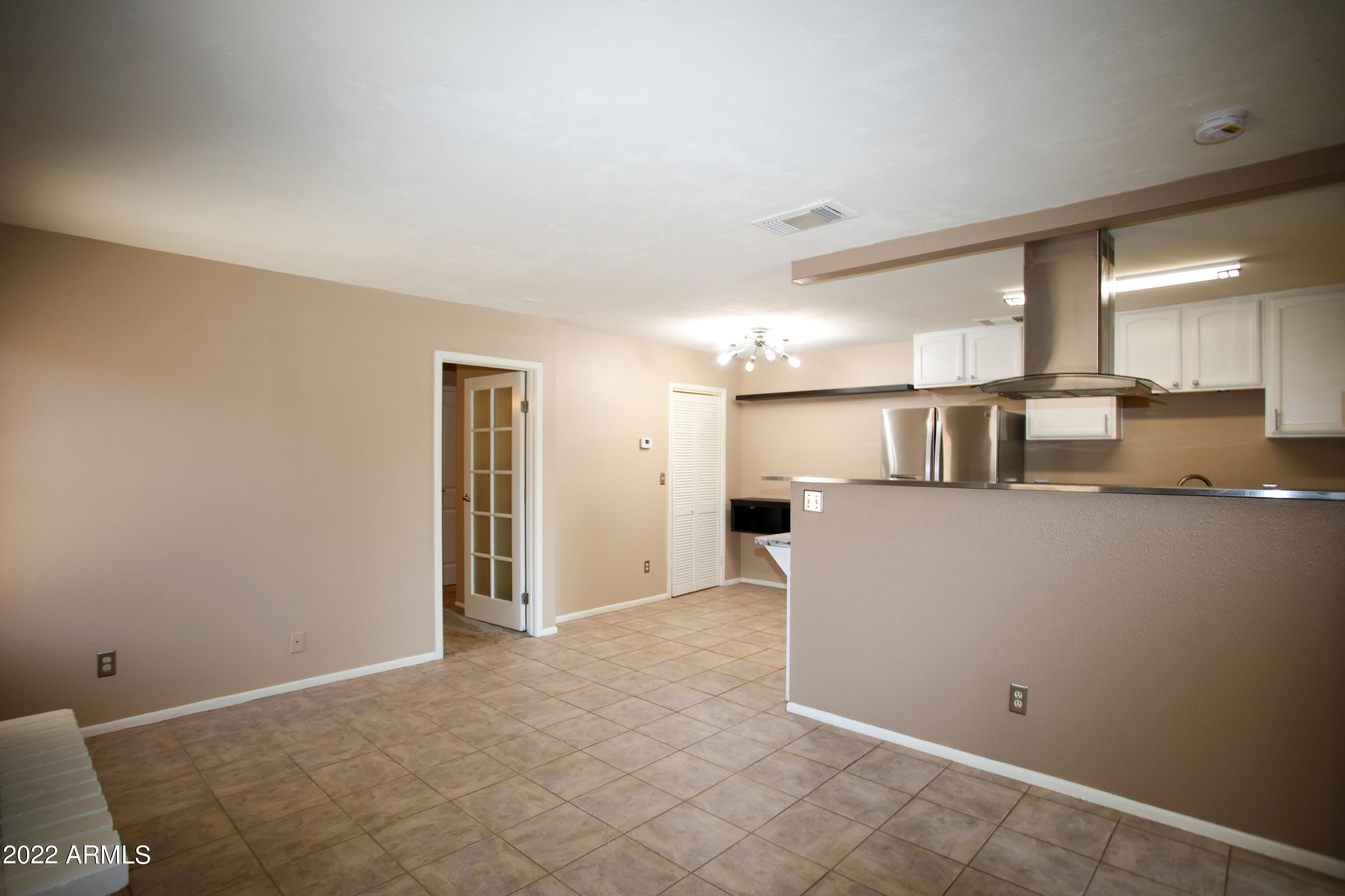 3511 East Baseline Road, Unit 1159 Phoenix, AZ 85042 - Photo 12 of 33 a view of kitchen with furniture and wooden floor