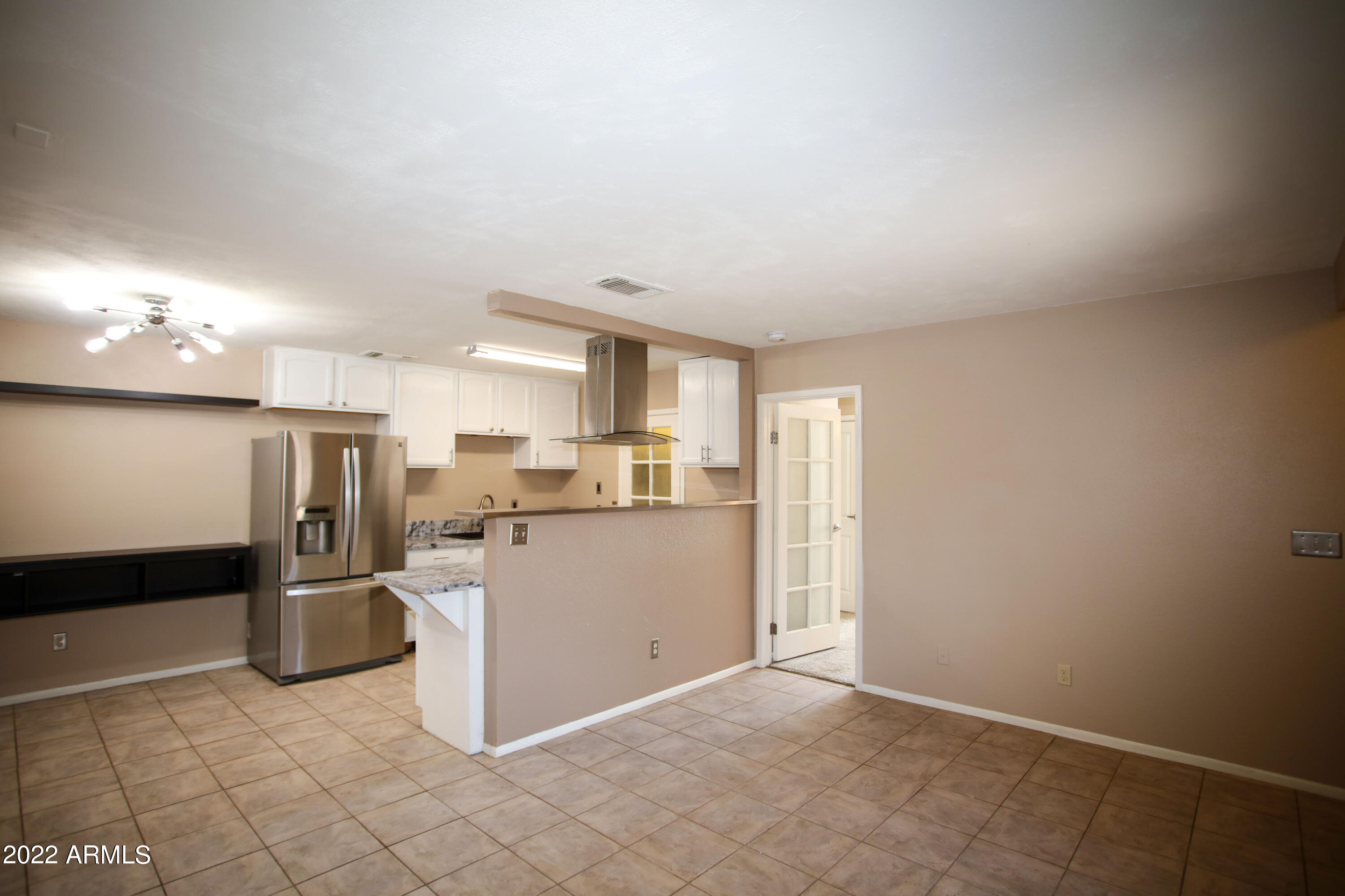 3511 East Baseline Road, Unit 1159 Phoenix, AZ 85042 - Photo 15 of 33 a kitchen with a refrigerator and a sink