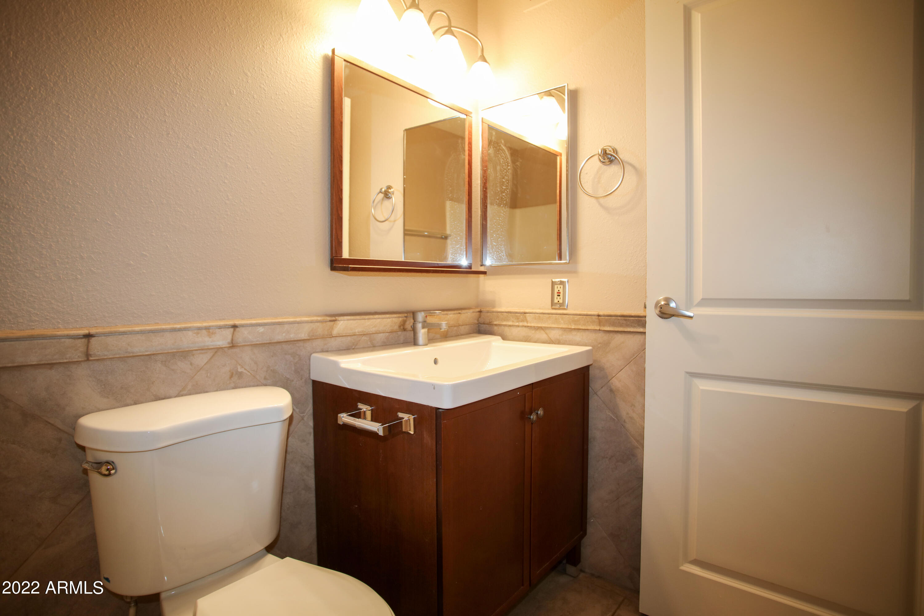 3511 East Baseline Road, Unit 1159 Phoenix, AZ 85042 - Photo 21 of 33 a bathroom with a sink toilet and shower