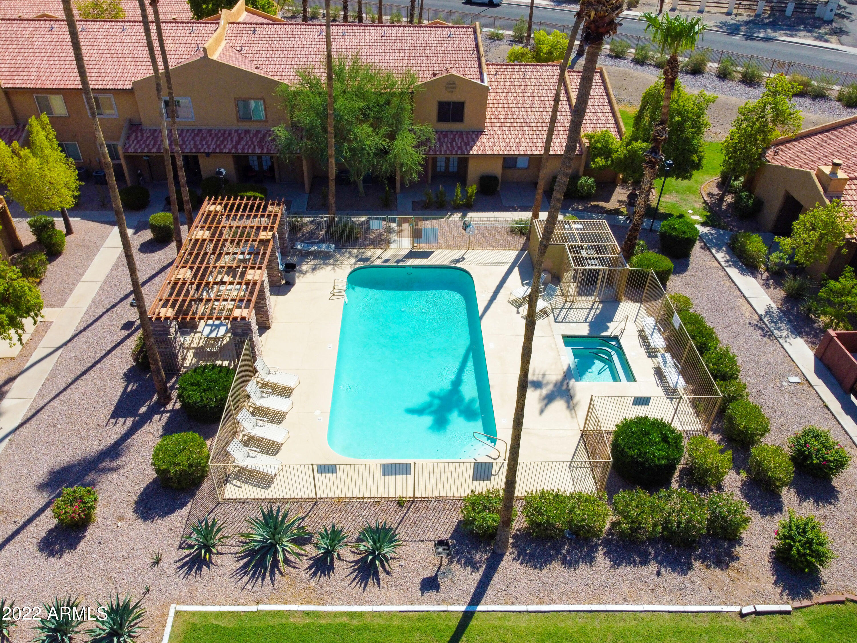 3511 East Baseline Road, Unit 1159 Phoenix, AZ 85042 - Photo 32 of 33 an aerial view of a house with garden space and swimming pool
