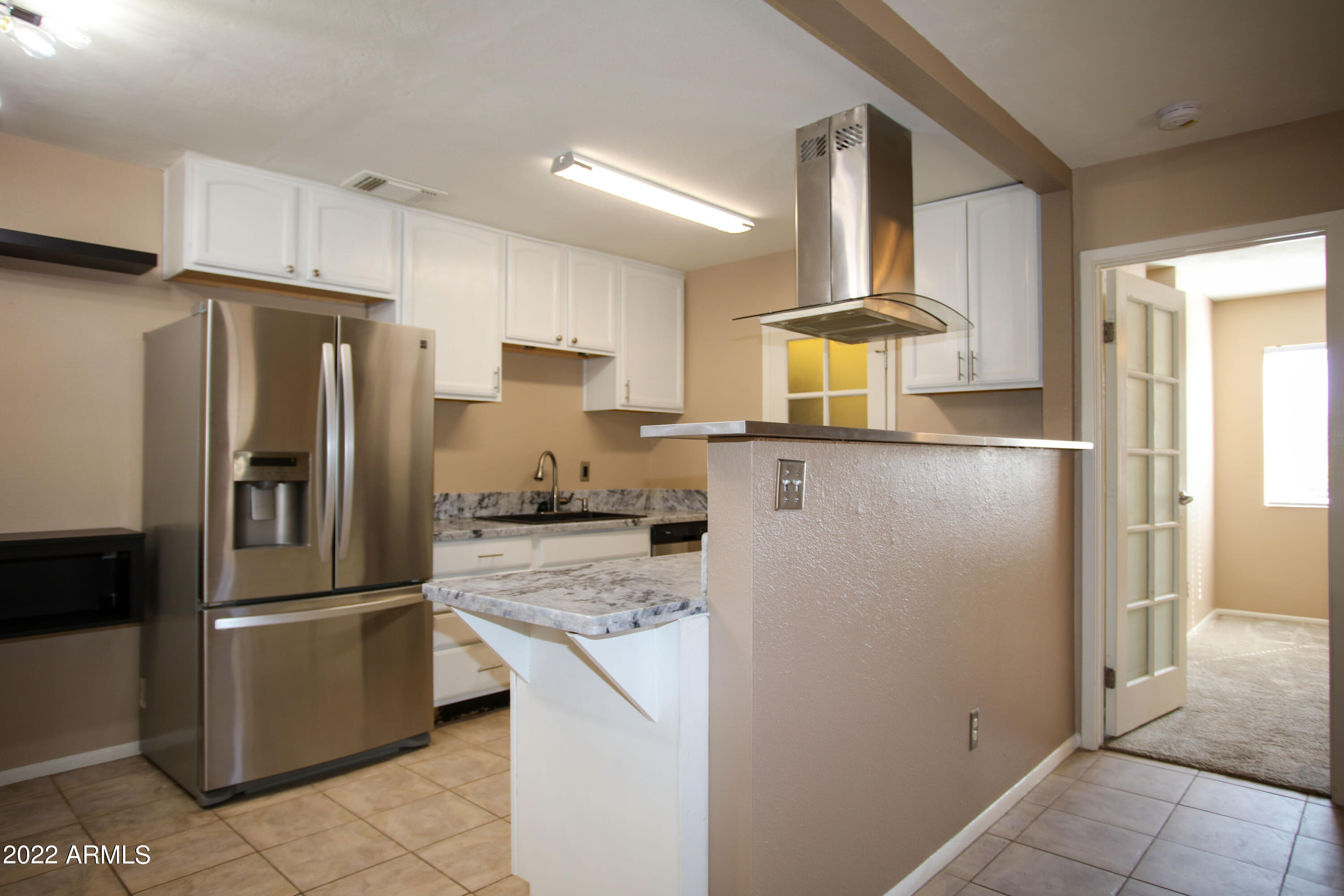 3511 East Baseline Road, Unit 1159 Phoenix, AZ 85042 - Photo 10 of 33 a kitchen with stainless steel appliances granite countertop a refrigerator a stove and a sink