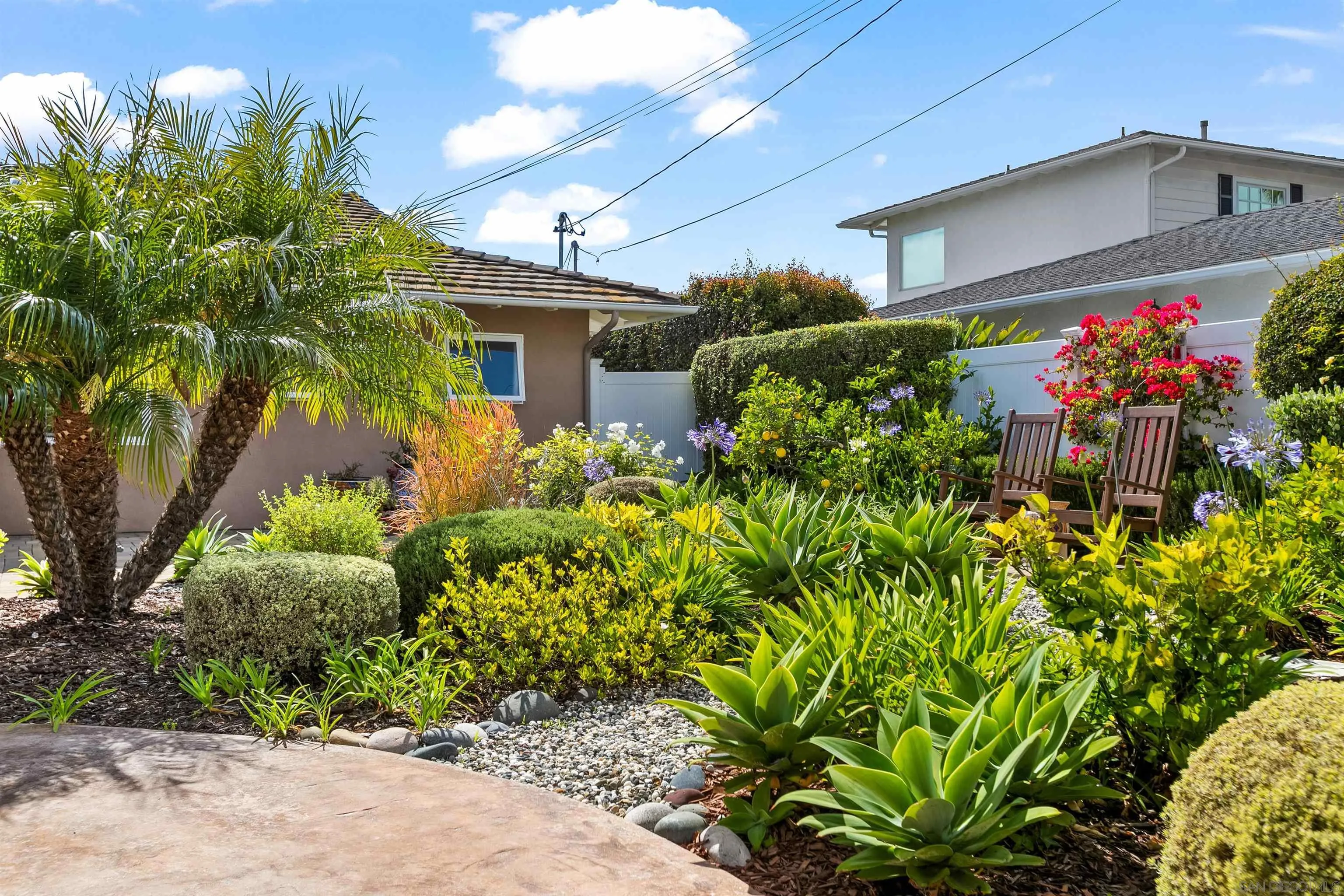 5958 Sagebrush Road La Jolla, CA 92037 - Photo 52 of 56 The front yard has a sitting area surrounded by citrus trees, and native and low water plants