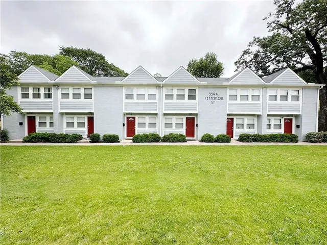 a view of a big yard of front a house