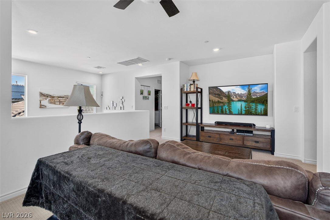 1824 Redland Ridge Street Henderson, NV 89002 - Photo 32 of 69 A versatile open-concept living space features recessed lighting and durable vinyl flooring.