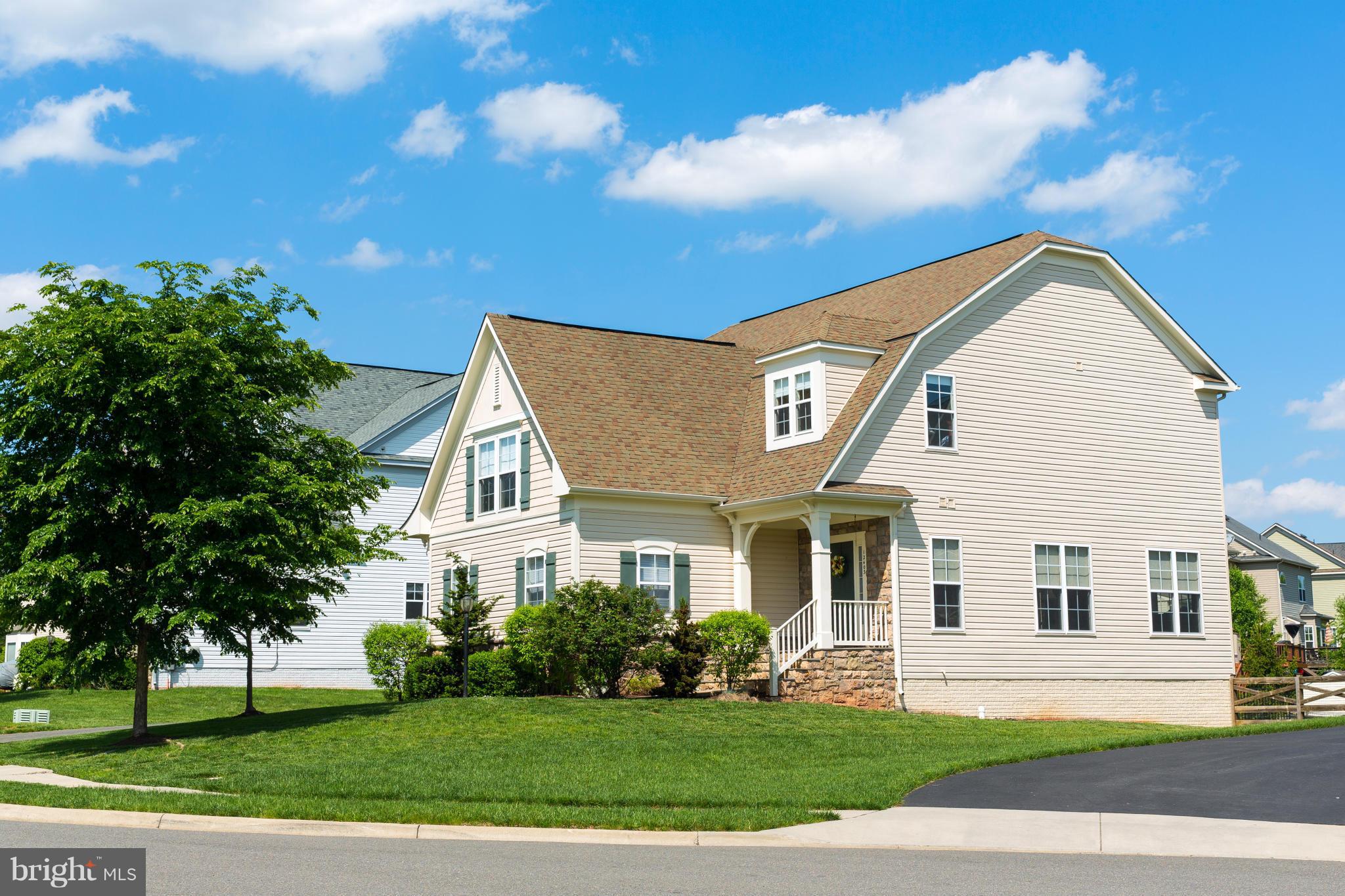 12403 Rochester Park Court Bristow, VA 20136 - Photo 1 of 30 a front view of a house with a yard
