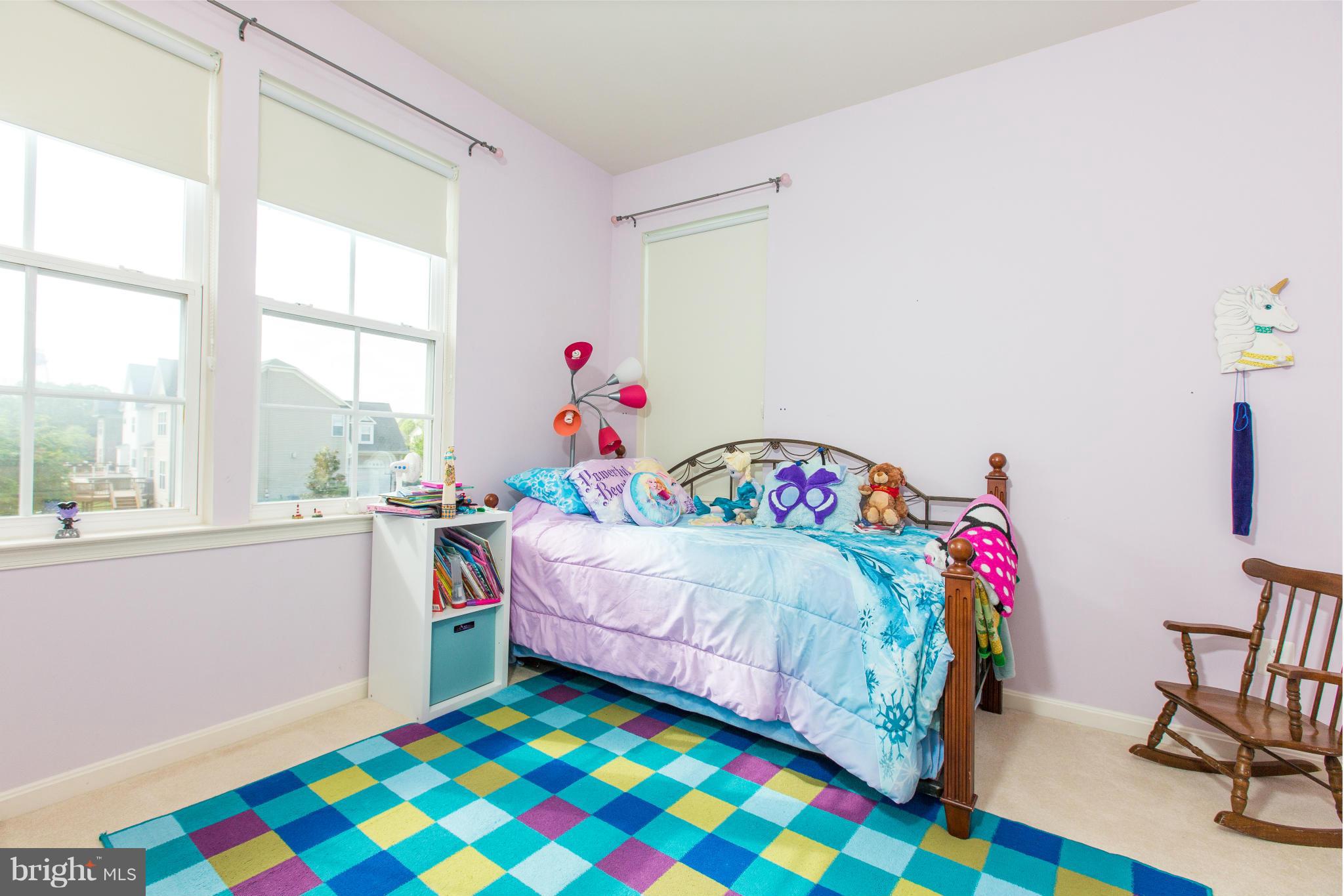 12403 Rochester Park Court Bristow, VA 20136 - Photo 25 of 30 a bedroom with a bed and a window