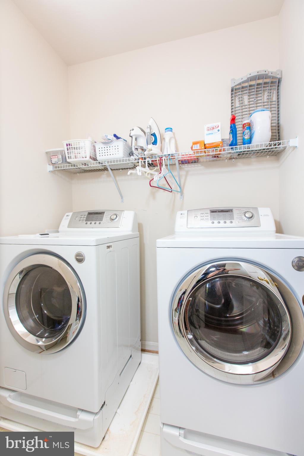 12403 Rochester Park Court Bristow, VA 20136 - Photo 29 of 30 a utility room with sink dryer and washer