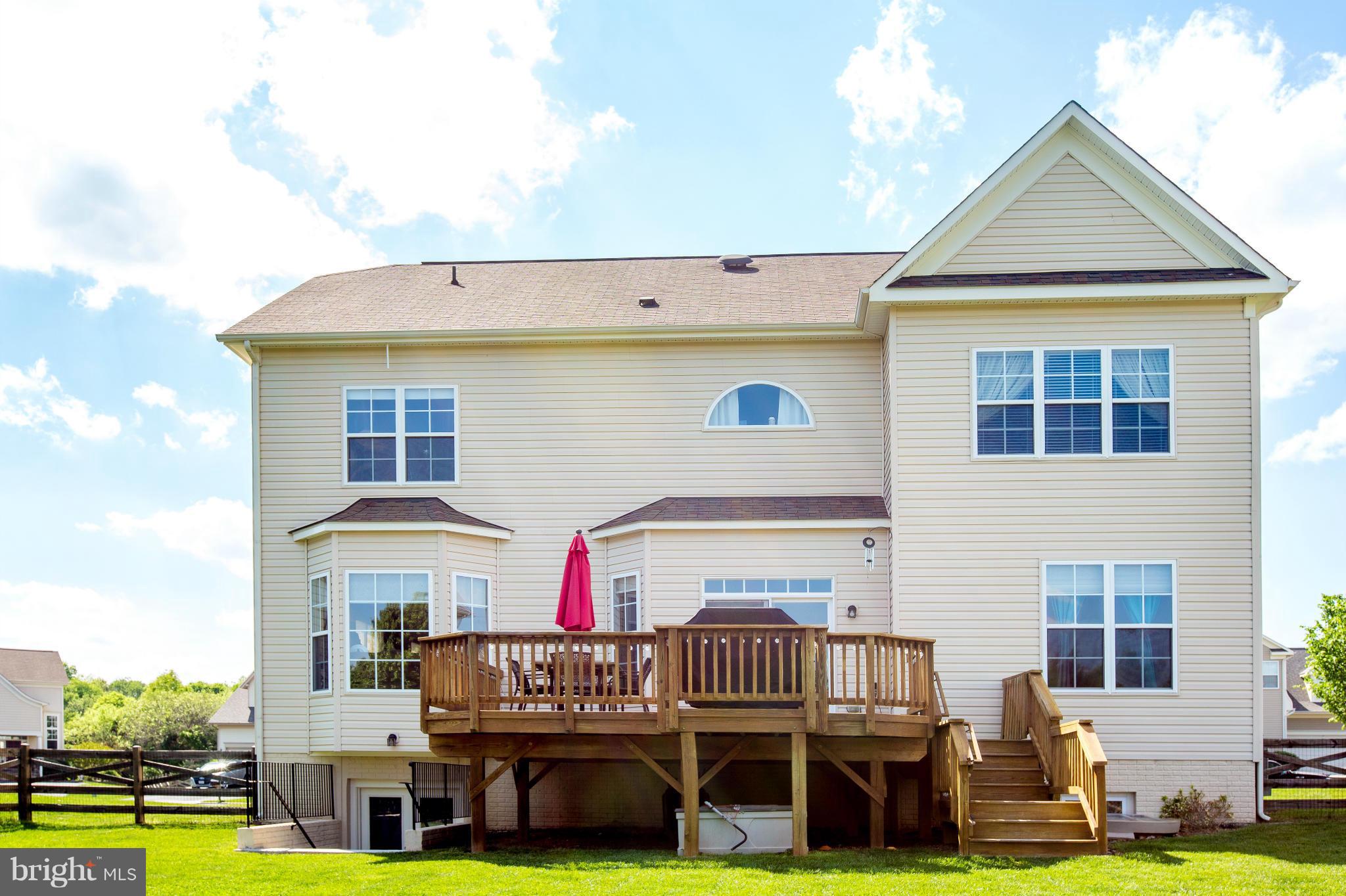 12403 Rochester Park Court Bristow, VA 20136 - Photo 5 of 30 a view of a house with swimming pool and porch