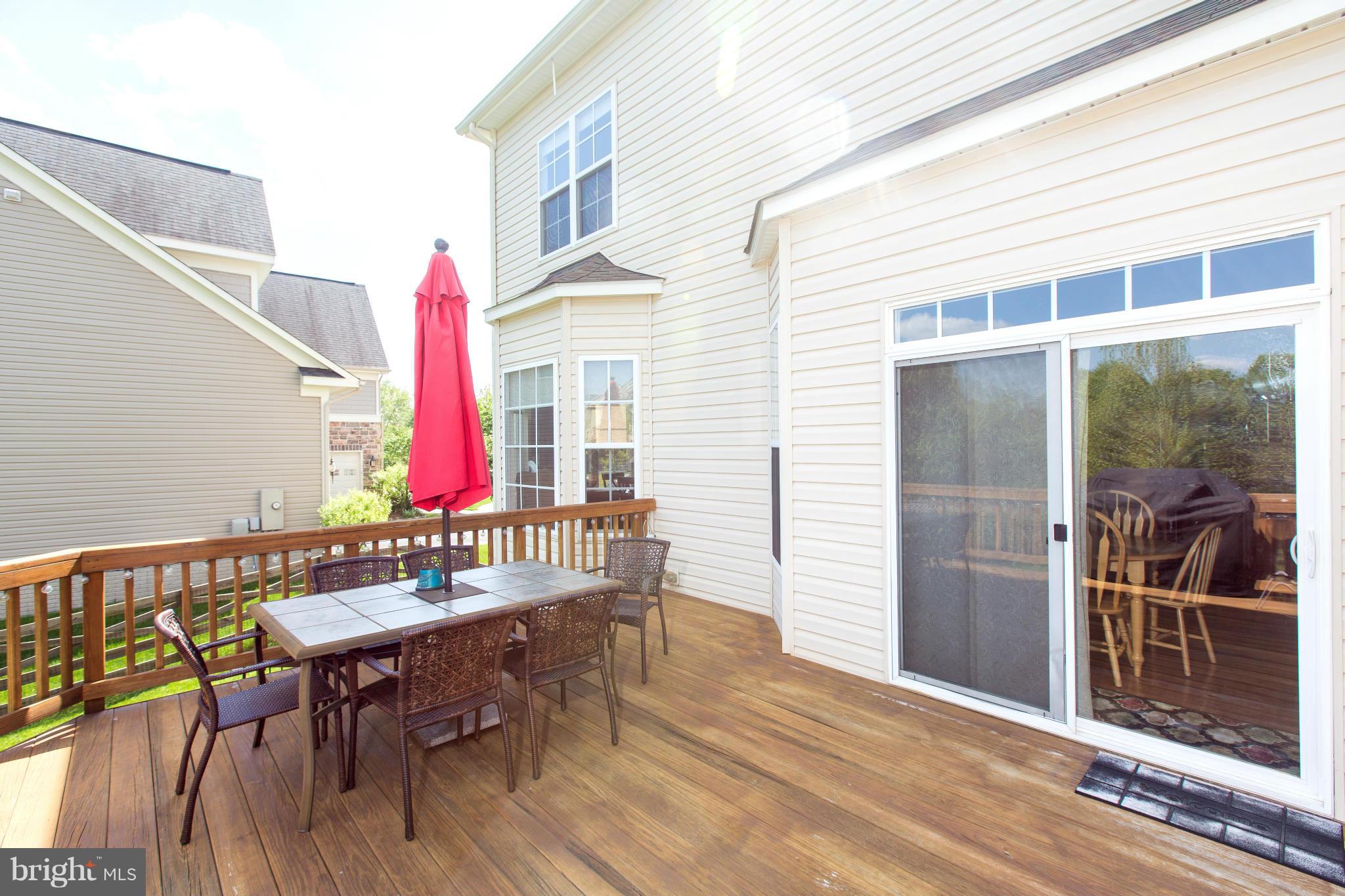 12403 Rochester Park Court Bristow, VA 20136 - Photo 7 of 30 a view of a chairs and table in the balcony